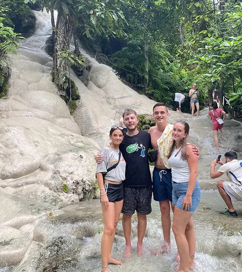 Guests exploring the Sticky Waterfall near Doi Lom